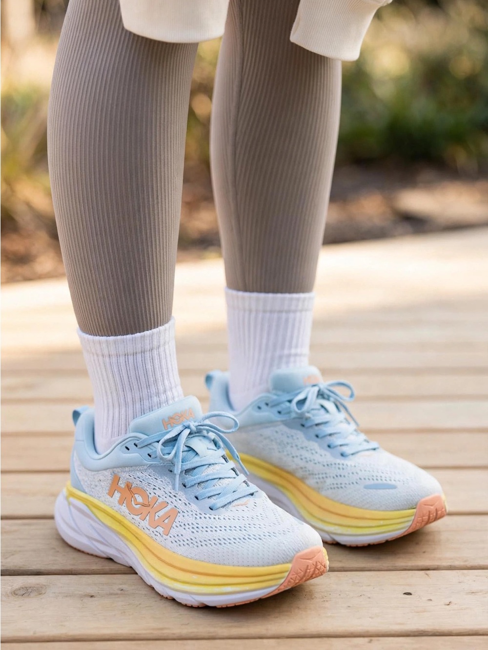 Hoka Women's Pale Blue Running Shoes with Yellow and Peach Accents